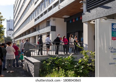 Angers, France - September 3 2020: People Wearing Face Protective Mask While Waiting In Line At The Social Security Office At France To Prevent Coronavirus, Concept Of Wearing Masks Outdoor Is