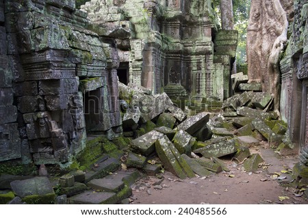 Angkor Wat jungle temple Ta Prohm crumbling architecture overgrown with moss