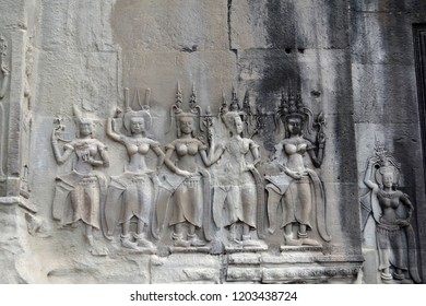 Angkor Wat temple complex in Cambodia and one of the largest religious monuments in the world. A huge temple complex with magnificent carved facades.A mesmerizing bas-relief depicting dancing girls.
