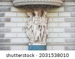 Angle of the building of 1875-1877, Three Maidens symbolizing fertility, art and navigation. Millionnaya Street and Mramorny Lane, St. Petersburg, Russia