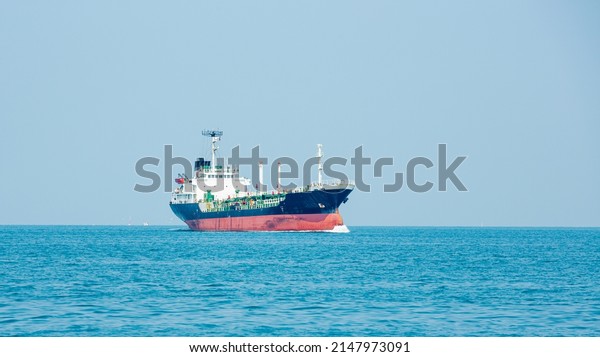 Angle side view of oil tanker\
container ship at sea. Crude oil tanker lpg ngv at industrial\
estate Thailand - Oil tanker ship to Port of Singapore - import\
export 