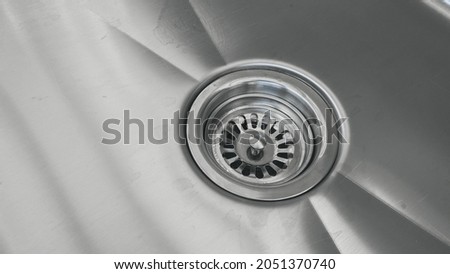 Angle view sink stainless steel background.  