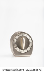 An angle view of a timer with the dial at 30 seconds or 30 minutes on a white background - Shutterstock ID 2217285573