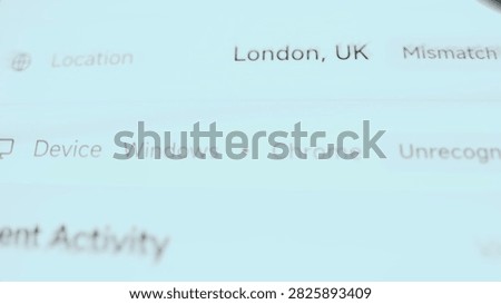 Angled close-up of a mobile banking security screen where an unrecognized desktop browser session with a location mismatch.