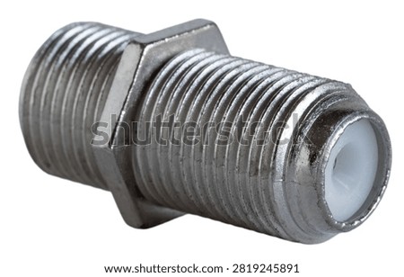 Angled close-up of the threaded female connector that is used to couple two sections of RG6 or RG59 coax together isolated on a white background.