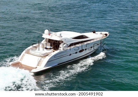 Angled elevated view of a high-end cabin cruiser on the Florida Intra-Coastal Waterway.
