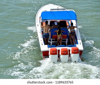 Angled Overhead View Of A High End Motor Boat Powered By Three Outboard Engines.