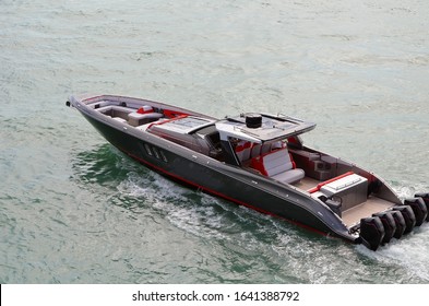 Angled Overhead View Of A High-end Speedboat P; Powered By Six Outboard Engines 