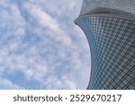 Angled view of modern skyscrapers in business district against blue sky. Looking Up  high-rise office buildings.