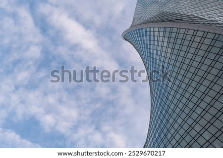 Angled view of modern skyscrapers in business district against blue sky. Looking Up  high-rise office buildings.