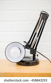 Anglepoise Lamp. Retro Table Top Light On White Brick Background. Cool Chic Interior Concept. Vertical