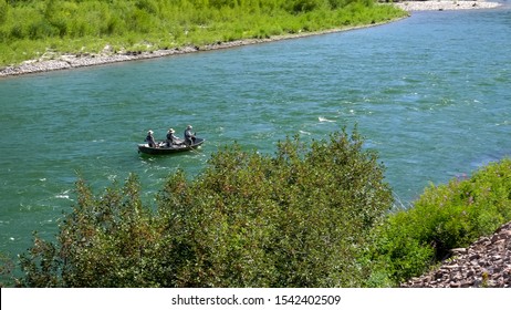 Anglers Fly Fishing From A Drift Boat On The Snake River