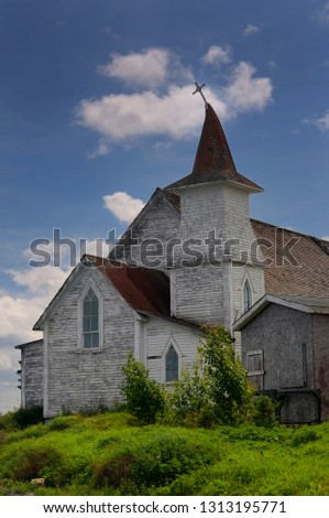 Anglican Christ Church with bent steeple and cross at Clarke's Head Gander Bay Newfoundland