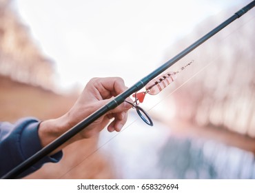 Angling. Close Up Photo Of Fisherman Hand And Fishing Lure. Sport, Recreation, Lifestyle