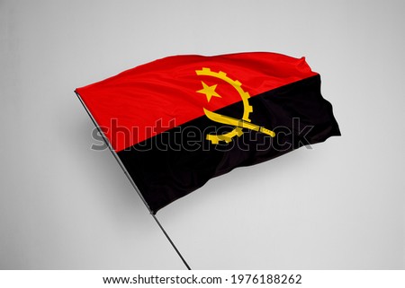 Angola flag isolated on white background with clipping path. close up waving flag of Angola. flag symbols of Angola. Angola flag frame with empty space for your text. 