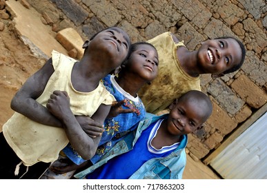 N´Dalatando, Angola, September 2013. Smiling African Children Looking To The Sky. 