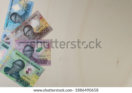 Angolan Kwanza - new serie of banknotes were put into circulation at the end of 2020.
Top view shot.