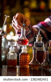 Angostura Bitters Standing On The Bar. Preparing A Cocktail.  Night Club Scenery.