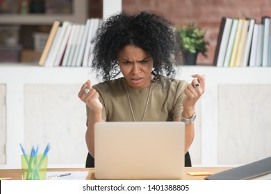 Angry African American Millennial Woman Get Annoyed Using Laptop Having Software Problem, Mad Black Female Witness Computer Virus Attack Or Spam, Furious Biracial Girl Experience Device Breakdown