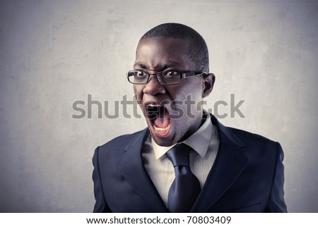 Angry african businessman shouting