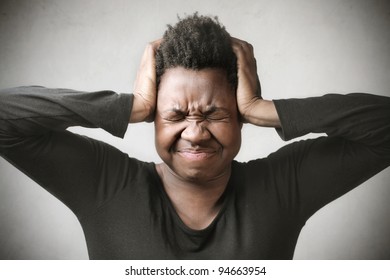 Angry African Woman Plugging Her Ears