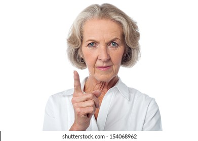 Angry aged woman warning you.
