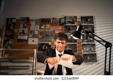 Angry Aggressive Detective Working In His Office Tearing Up Paper While Having Workplace Stress. Negative Emotions And Work Concept