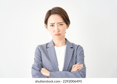 Angry Asian businesswoman in white background - Shutterstock ID 2292006495
