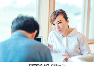 Angry Asian Female Nurse And Male Patient