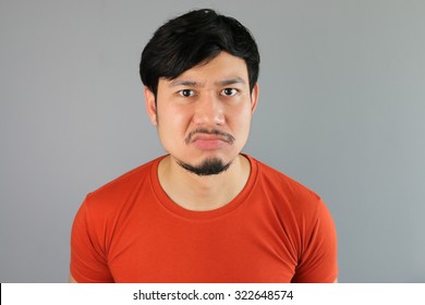 Angry Asian Man In Red T-shirt.