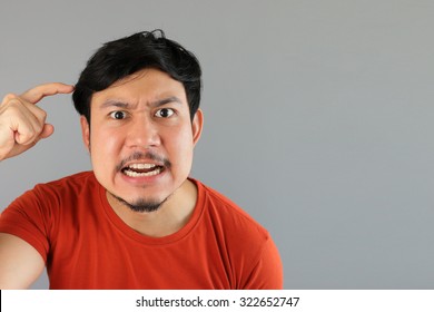 Angry Asian Man In Red T-shirt.