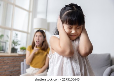 Angry Asian Mother Yelling At Her Stubborn Daughter For Domestic Violence Concept