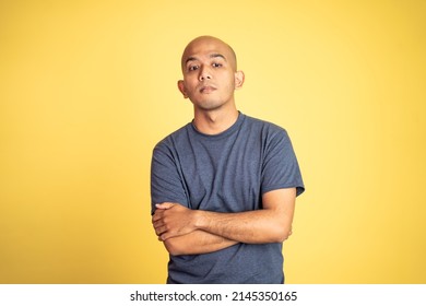 Angry Bald Man In T-shirt With Arms Crossed