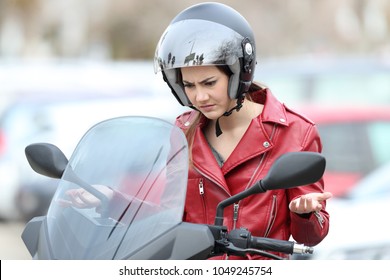 Angry Biker On A Broken Down Motorbike On The Street