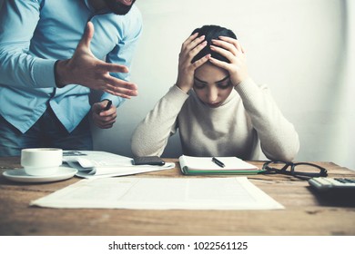 Angry Boss And Sad Woman In Office