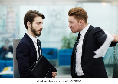 Angry Boss Shouting At One Of Employees