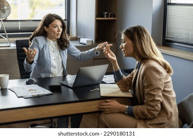 Angry boss yelling at her employee, she is stressed and feeling frustrated on work.Young ambitious female boss yelling at new unhappy female employee.Mobbing at work. - Shutterstock ID 2290180131