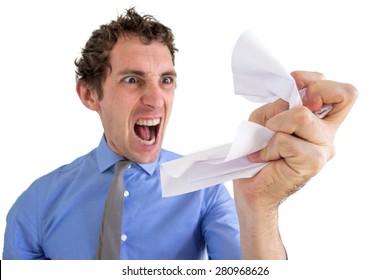 Angry Business Man Crumpling A Piece Of Paper