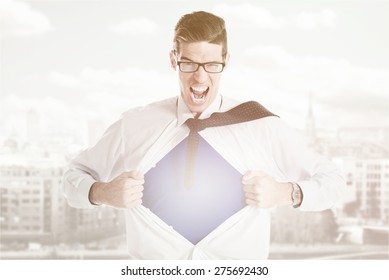 Angry Businessman Ripping Open His Shirt And Exposing A Superhero Red Costume Underneath. The Man Is Wearing Glasses And Looking At Camera.