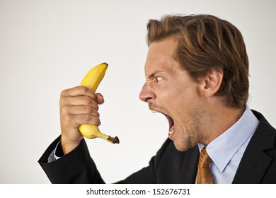 Angry Businessman Shouting At Fruit