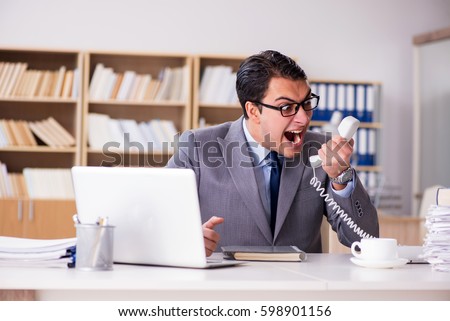 Angry businessman working in the office
