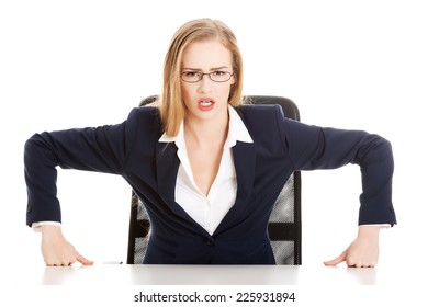 Angry Businesswoman At The Desk