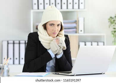 Angry Businesswoman Having Cold Looking At Camera At Office