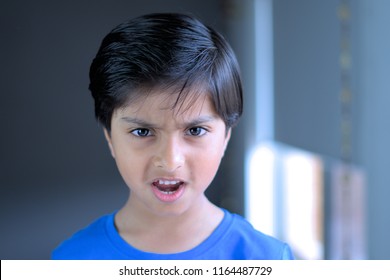 Angry Child Throwing Tantrum. Upset Kid Bad Temper.