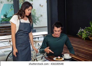 Angry Client Quarreling With Waitress About Wrong Order In Coffee Shop