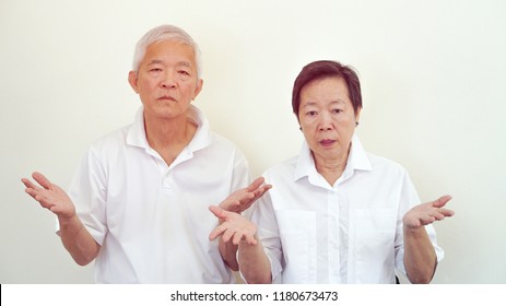 Angry Complaining Asian Elderly Couple With Upset Expression And Gesture