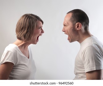 Angry couple screaming against each other