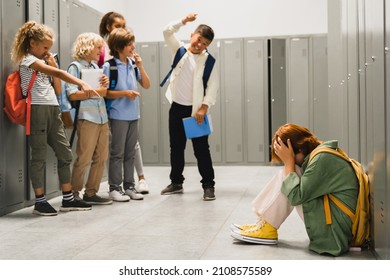 Angry cruel teenagers laughing at their classmate. Elementary school age bullying at school. Social inequality problem. Schoolchildren baiting - Powered by Shutterstock