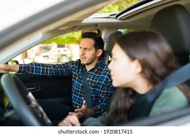 Angry Dad Screaming To Her Adolescent Daughter During Her Driving Lessons Because She Caused A Car Crash For Speeding 