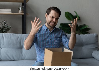 Angry Dissatisfied Customer Receiving Wrong Parcel From Internet Store. Frustrated Annoyed Man, Client, Shopper Opening Box, Looking At Damaged Goods. Delivery Service Error, Courier Mistake Concept